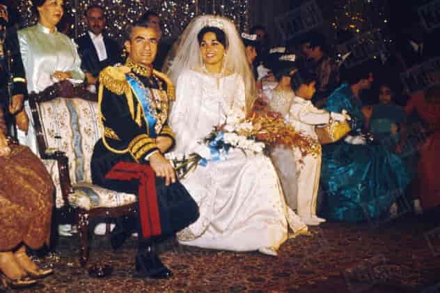 Reza Pahlavi speaking at a public event, advocating for democracy in Iran
