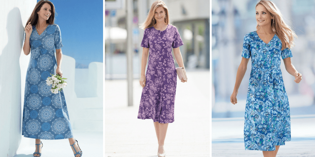 Flat lay of colorful cotton summer dresses with sleeves arranged neatly on a white background.